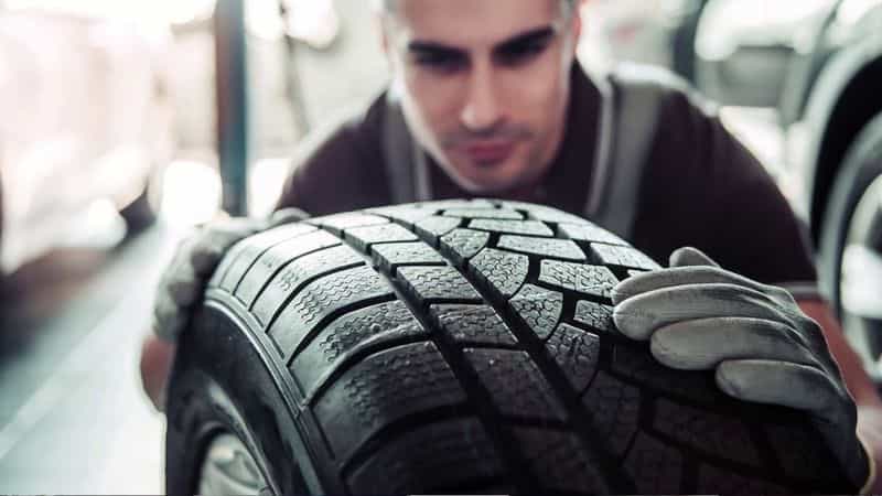 Technicians handling commercial tires at Modern Tire House
